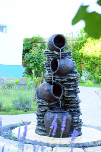 a water fountain that is made out of tires at Hotel Sunrise in Crisan