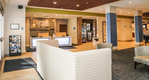 a lobby of a store with chairs and a counter at Holiday Inn Express & Suites Kingston-Ulster by IHG in Lake Katrine