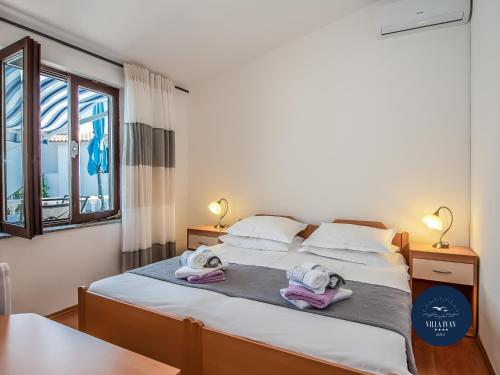 Ένα ή περισσότερα κρεβάτια σε δωμάτιο στο Villa Ivan