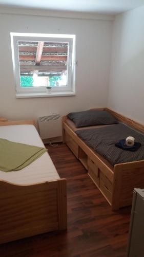 Кровать или кровати в номере Černá Kočka- Low cost ubytování