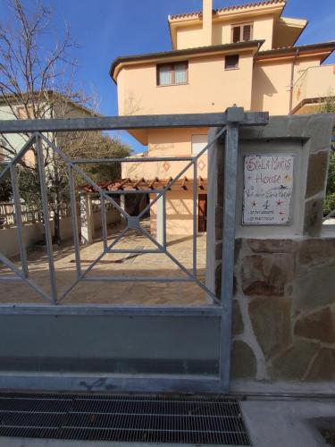 a building with a sign in front of a building at Apartment Stella Maris in Cala Gonone