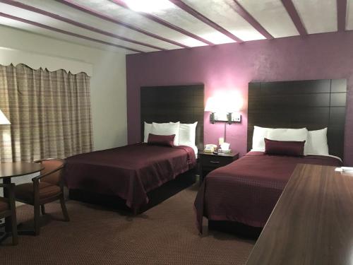 Katil atau katil-katil dalam bilik di Silver Princess Motel