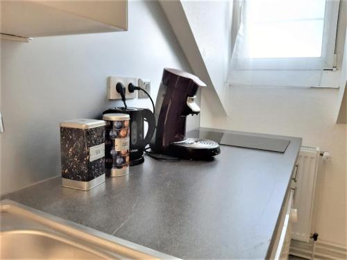 a kitchen counter with a coffee maker on it at MyHome Basel 3A44 in Saint-Louis