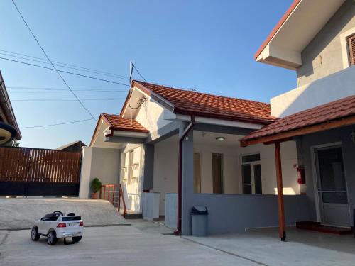 a toy truck parked outside of a house at TIKI Apartments in Gevgelija