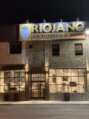 a building with a large sign on the front of it at Hotel Riojano in Humanes de Madrid