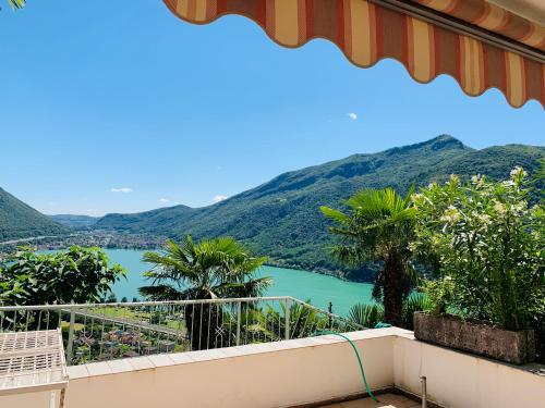 a view of a lake from a balcony at Casa Rosa in Rovio