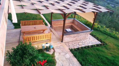 an overhead view of a bench and an umbrella at Villa15 Lodge, Five-Star Stay 5BD 5-5BA Beach Access Villa with Pool , Gym, Sauna, Alfresco Dining & Garden in Manavgat