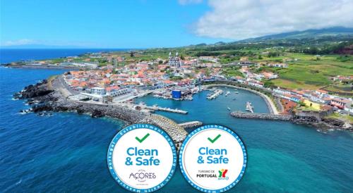 two signs for clean and safe on a small island at Marina de São Mateus in Angra do Heroísmo