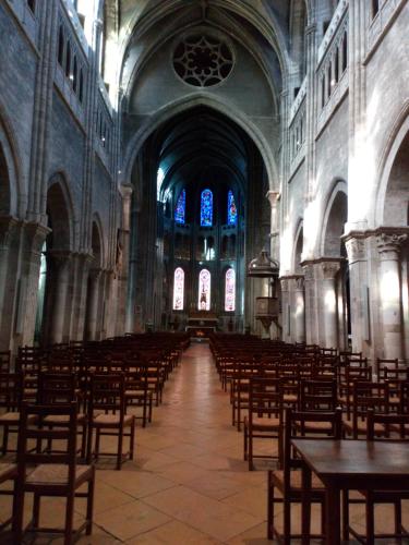 an empty church with tables and chairs in it at CHAMBRE CHEZ L HABITANT in Chalon-sur-Saône