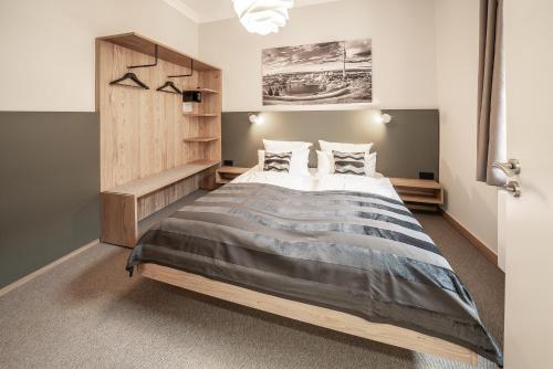 a bedroom with a large bed in a room at Hotel Am Markt in Munich