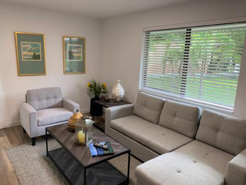 a living room with a couch and a table at Harbourside Flats in Fort Lauderdale