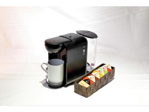 a coffee maker and a cup of coffee at Act Hotel Roppongi - Vacation STAY 84276 in Tokyo