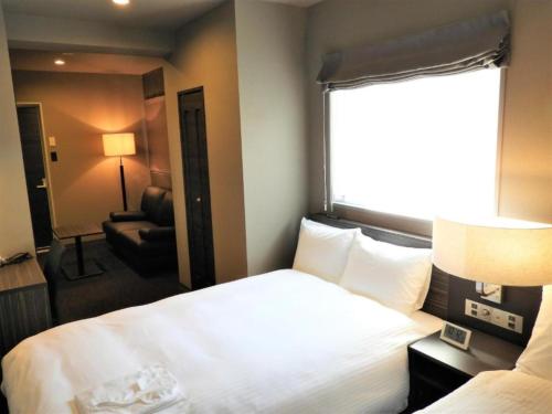 En eller flere senge i et værelse på Act Hotel Roppongi - Vacation STAY 85367