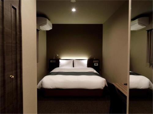 Tempat tidur dalam kamar di Act Hotel Roppongi - Vacation STAY 85366