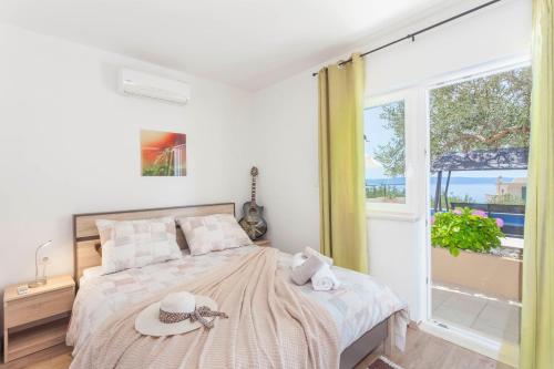 Posteľ alebo postele v izbe v ubytovaní House Arija