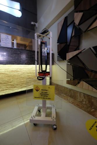a exhibit in a museum with a sign in a room at Oriental Zen Suites in Manila