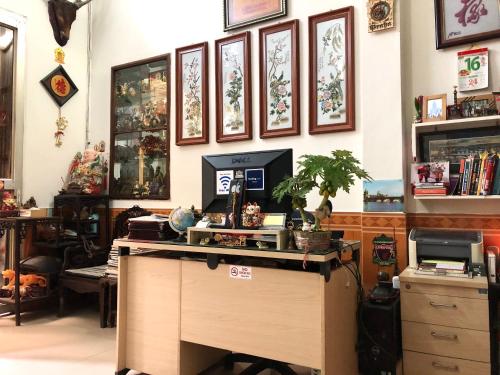 a room with a desk with a computer on it at North Hostel N.2 in Hanoi