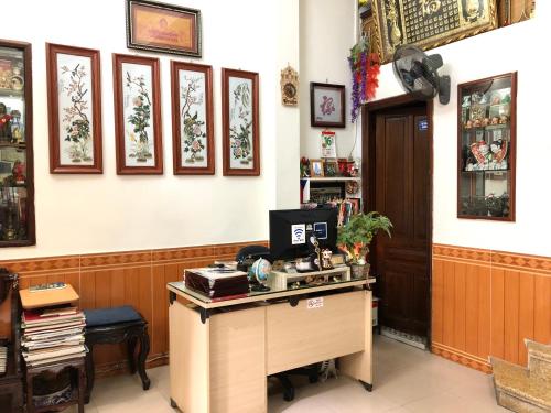 an office with a desk with a computer on it at North Hostel N.2 in Hanoi