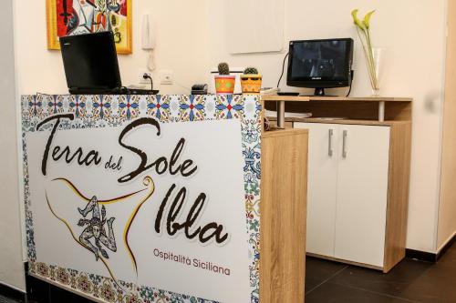 a sign for a yoga studio in a room at Bed and Breakfast Terra del Sole Ibla in Ragusa