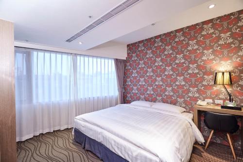 Postel nebo postele na pokoji v ubytování RF Hotel - Zhongxiao