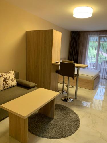 a living room with a couch and a table at Apartments KiM Sandanski in Sandanski