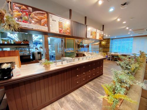 a fast food restaurant with a counter with a buffet at Center Hotel Narita2 R51 in Narita