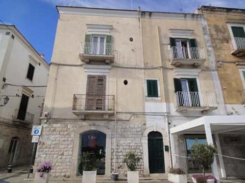 a large building with two balconies on the side of it at B&B Suite Home Trani in Trani