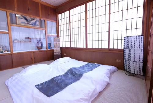 Ένα ή περισσότερα κρεβάτια σε δωμάτιο στο Kumi no Yado Gettou 2