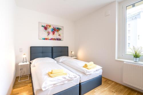 Katil atau katil-katil dalam bilik di FeelGood Apartments SmartLiving | contactless check-in
