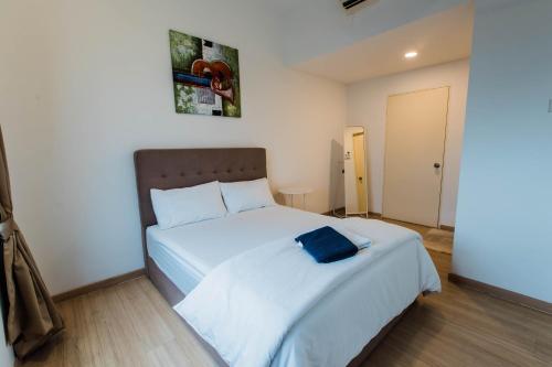 Postel nebo postele na pokoji v ubytování Cozy Homestay with WiFi @Encorp Strand Mall @Alpha IVF