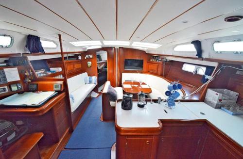 a small boat with a desk and a sink in it at LUXURY YACHT STAY "White Dove" sleeps 6 in Gibraltar