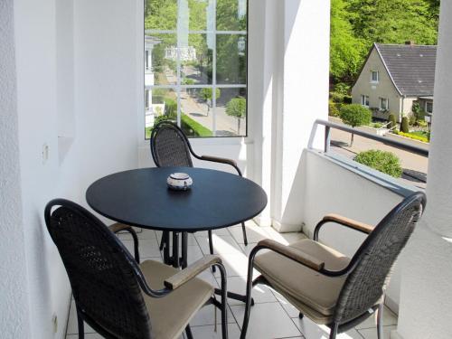 a balcony with a table and chairs and a window at Apartment Villa Imperator by Interhome in Ostseebad Sellin