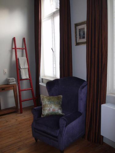 Un lugar para sentarse en B&B Huis Willaeys