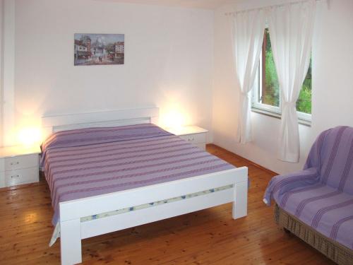 Ένα ή περισσότερα κρεβάτια σε δωμάτιο στο Apartment Giuliano-3 by Interhome