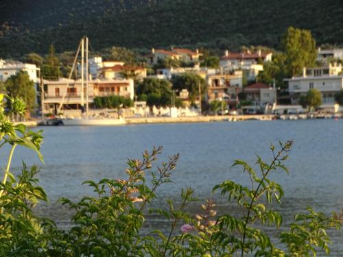 a view of a body of water with houses and buildings at Blue Dreams in Almiropótamos