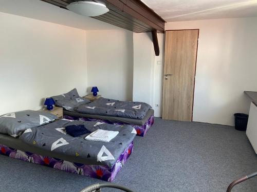 Кровать или кровати в номере Penzion Dagmar