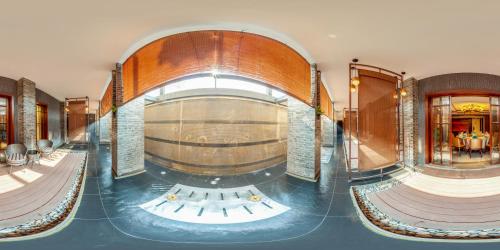 a large room with a wine cellar in a building at Tea Boutique Hotel West Lake in Hangzhou