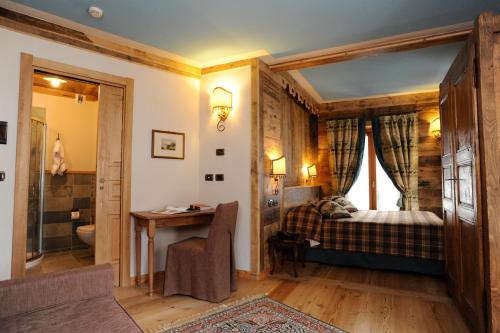 Postel nebo postele na pokoji v ubytování Laghetto Alpine Hotel & Restaurant