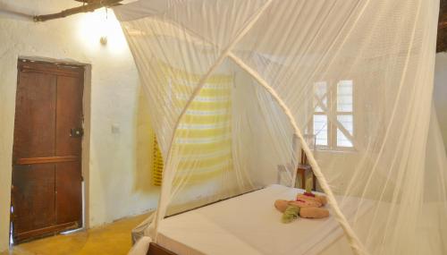 Postel nebo postele na pokoji v ubytování Evergreen Bungalows