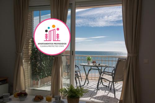 a balcony with a view of the ocean at SingularStays El Faro in Puzol
