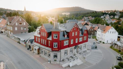 an aerial view of a town with a red building at StrandBerg's Designhotel Viktoria in Braunlage