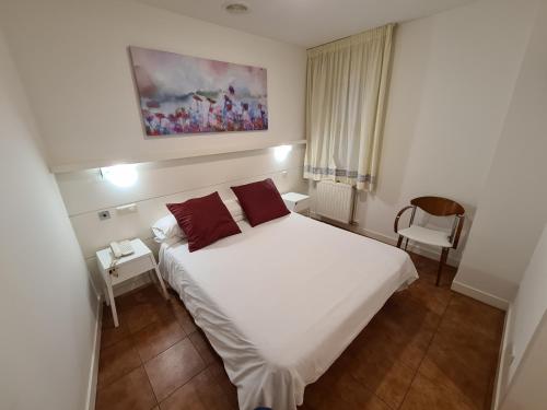 מיטה או מיטות בחדר ב-Hotel Jacobeo
