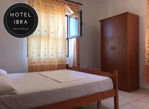 Llit o llits en una habitació de Hotel Ibra