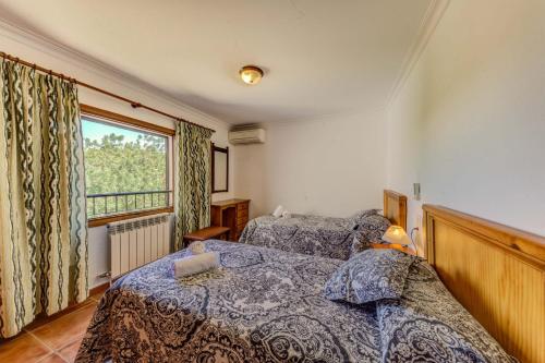 Katil atau katil-katil dalam bilik di Villa Salve