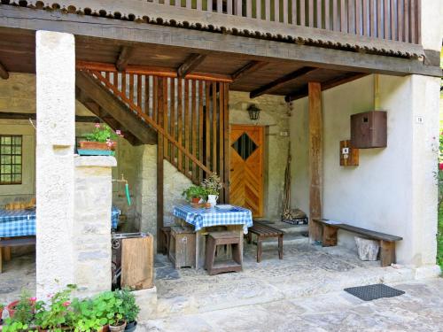 an outdoor patio with a table and a bench at Holiday Home Casa Polava by Interhome in Cepletischis