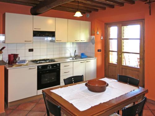 a kitchen with a table with a bowl on it at Holiday Home Belvedere - BLU101 by Interhome in Bagni di Lucca