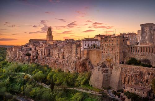 a view of a city with buildings on a mountain at La Casa del Villanu in Pitigliano