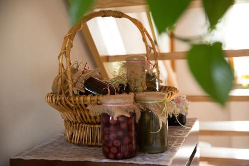 a basket filled withectarines sitting on top of a table at Śmietanówka Agroturystyka in Krzczonów