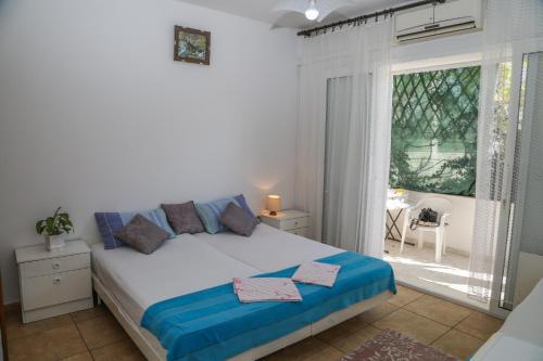 Cama o camas de una habitación en Apartments Butkovic