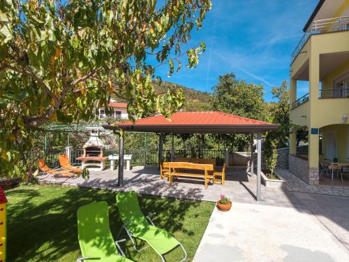 a backyard with a gazebo and a table and chairs at Apartment Andrea - MOD141 by Interhome in Martina